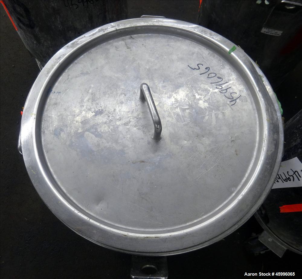 Used Tank, Approximate 30 Gallon, 304 Stainless Steel, Jacketed, Vertical. 20" diameter x 26" straight side. Pitched sloped bottom, open top, with a 2" side bottom outlet. Includes attached heating e...