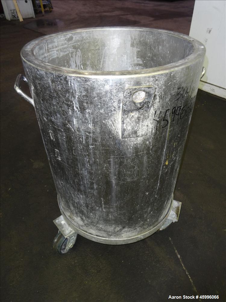 Used Tank, Approximate 30 Gallon, 304 Stainless Steel, Jacketed, Vertical. 20" diameter x 26" straight side. Pitched sloped bottom, open top, with a 2" side bottom outlet. Includes attached heating e...