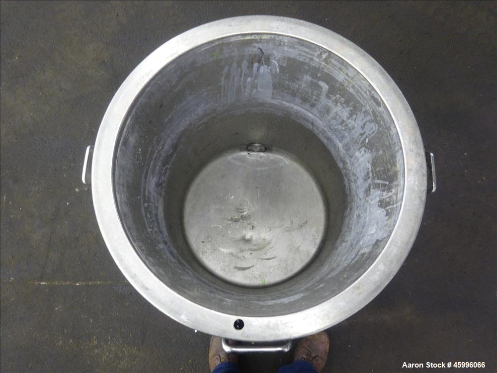 Used Tank, Approximate 30 Gallon, 304 Stainless Steel, Jacketed, Vertical. 20" diameter x 26" straight side. Pitched sloped bottom, open top, with a 2" side bottom outlet. Includes attached heating e...