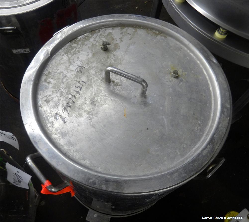 Used Tank, Approximate 30 Gallon, 304 Stainless Steel, Jacketed, Vertical. 20" diameter x 26" straight side. Pitched sloped bottom, open top, with a 2" side bottom outlet. Includes attached heating e...