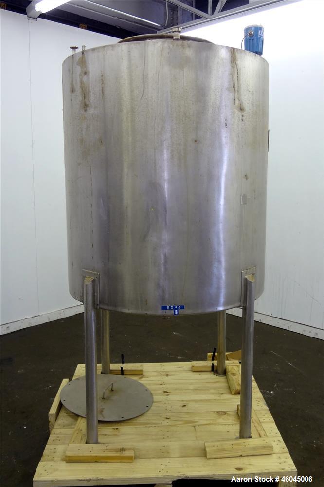 Used Tank, Approximate 330 Gallons, 304 Stainless Steel, Vertical. 45" diameter x 48" straight side, slight cone top, cone bottom. Top openings: 20" man way with cover, (3) 1" threaded, 2" threaded. ...