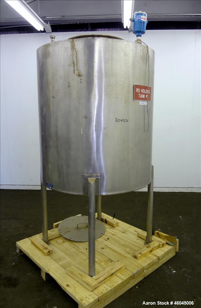 Used Tank, Approximate 330 Gallons, 304 Stainless Steel, Vertical. 45" diameter x 48" straight side, slight cone top, cone bottom. Top openings: 20" man way with cover, (3) 1" threaded, 2" threaded. ...