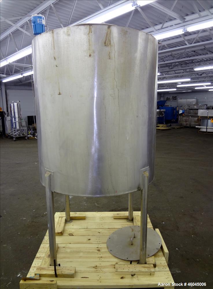 Used Tank, Approximate 330 Gallons, 304 Stainless Steel, Vertical. 45" diameter x 48" straight side, slight cone top, cone bottom. Top openings: 20" man way with cover, (3) 1" threaded, 2" threaded. ...