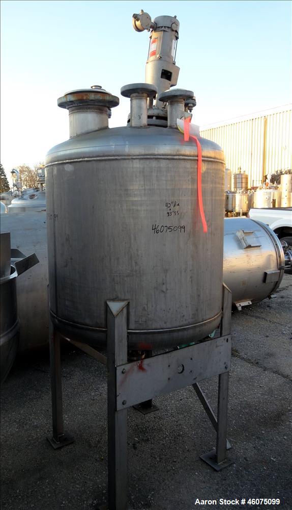 Used Tank, 225 Gallon, 304 Stainless Steel, Vertical. Approximate 42" diameter x 34" straight side, dished top & bottom. Off center top entering Lightnin agitator, model XJSS, serial# R0060117001. Ap...