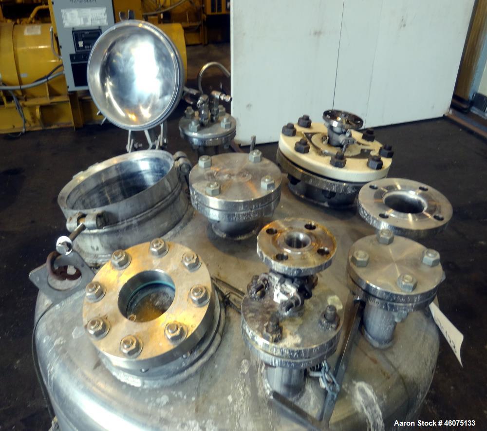 Used Tank, 200 Gallon, 316 Stainless Steel, Vertical. Approximate 36" diameter x 43" straight side, dished top & bottom. Off center top entering Lightnin agitator, model EKXJAC-43, serial# 93/B35832-...