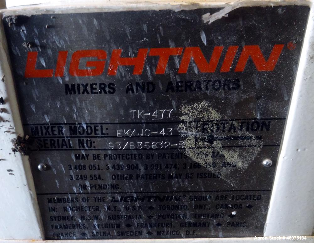 Used Tank, 200 Gallon, 316 Stainless Steel, Vertical. Approximate 36" diameter x 43" straight side, dished top & bottom. Off center top entering Lightnin agitator, model EKXJAC-43, serial# 93/B35832-...
