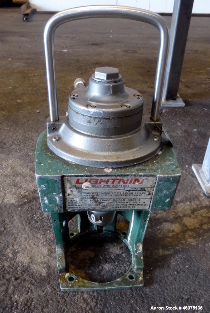 Used Tank, 200 Gallon, 316 Stainless Steel, Vertical. Approximate 36" diameter x 43" straight side, dished top & bottom. Off center top entering air operated Lightnin agitator, model N33AR-33, serial...