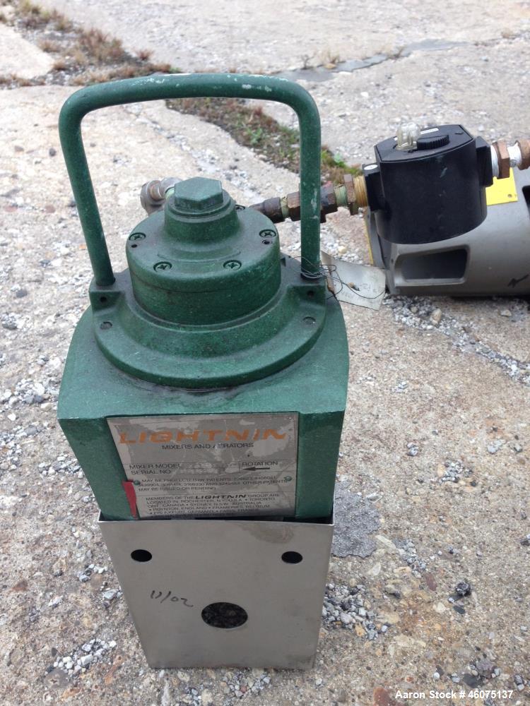 Used Tank, 100 Gallon, 304 Stainless Steel, Vertical. Approximate 30" diameter x 30" straight side, dished top and bottom. Off center top entering air operated Lightnin agitator, model XJAC-33, seria...