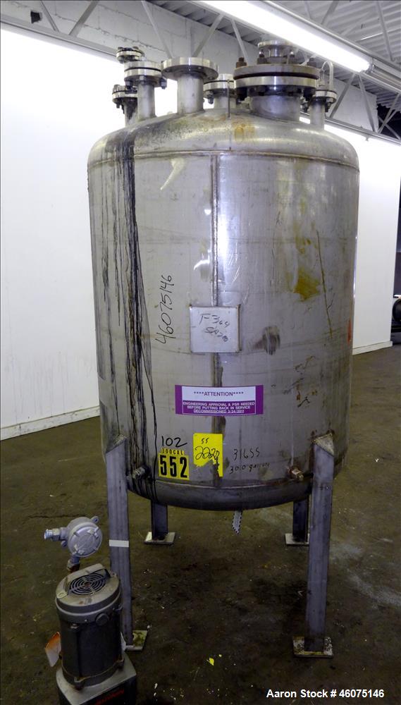 Used Tank, 275 Gallon, 316 Stainless Steel, Vertical. Approximate 42" diameter x 42" straight side, dished top & bottom. Off center top entering Lightnin agitator, model EKXJC-65, serial# 93/B35821-0...