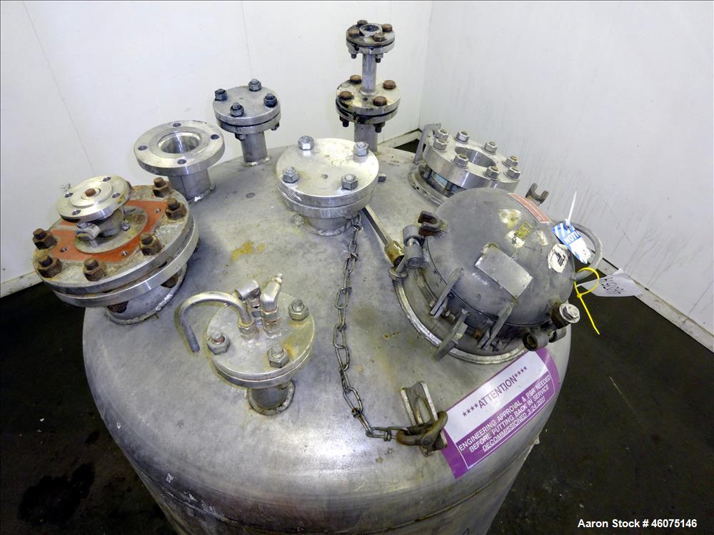 Used Tank, 275 Gallon, 316 Stainless Steel, Vertical. Approximate 42" diameter x 42" straight side, dished top & bottom. Off center top entering Lightnin agitator, model EKXJC-65, serial# 93/B35821-0...