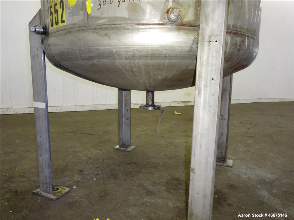 Used Tank, 275 Gallon, 316 Stainless Steel, Vertical. Approximate 42" diameter x 42" straight side, dished top & bottom. Off center top entering Lightnin agitator, model EKXJC-65, serial# 93/B35821-0...