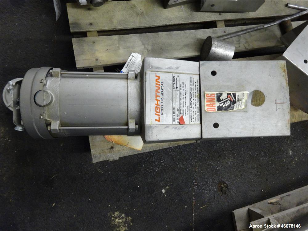 Used Tank, 275 Gallon, 316 Stainless Steel, Vertical. Approximate 42" diameter x 42" straight side, dished top & bottom. Off center top entering Lightnin agitator, model EKXJC-65, serial# 93/B35821-0...