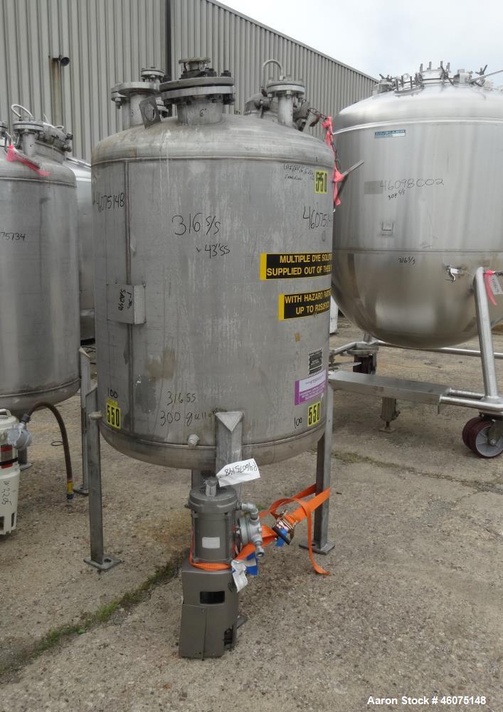 Used Tank, 275 Gallon, 316 Stainless Steel, Vertical. Approximate 42" diameter x 43" straight side, dished top & bottom. Off center top entering Lightnin agitator, model EKXJC-65, serial# 93/B35821-0...