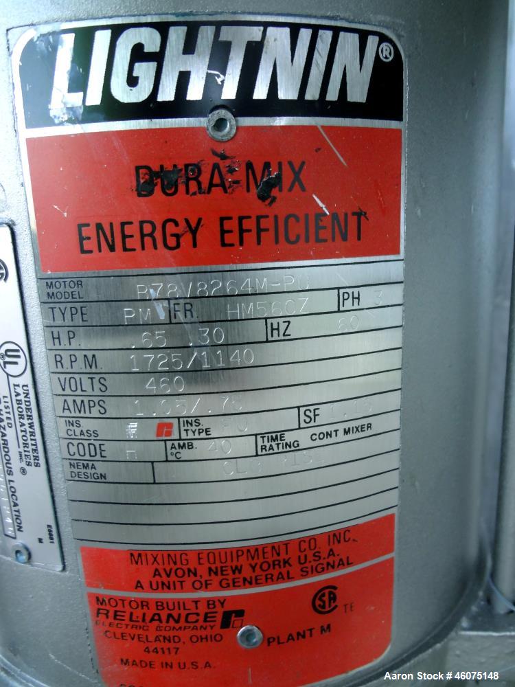 Used Tank, 275 Gallon, 316 Stainless Steel, Vertical. Approximate 42" diameter x 43" straight side, dished top & bottom. Off center top entering Lightnin agitator, model EKXJC-65, serial# 93/B35821-0...