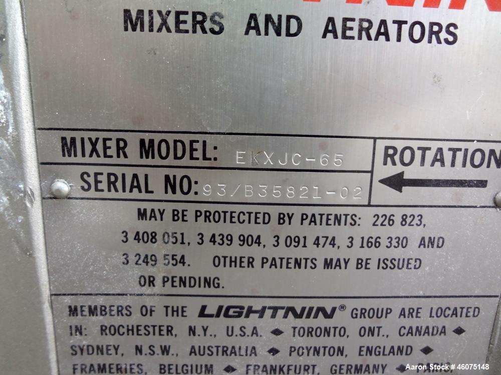 Used Tank, 275 Gallon, 316 Stainless Steel, Vertical. Approximate 42" diameter x 43" straight side, dished top & bottom. Off center top entering Lightnin agitator, model EKXJC-65, serial# 93/B35821-0...