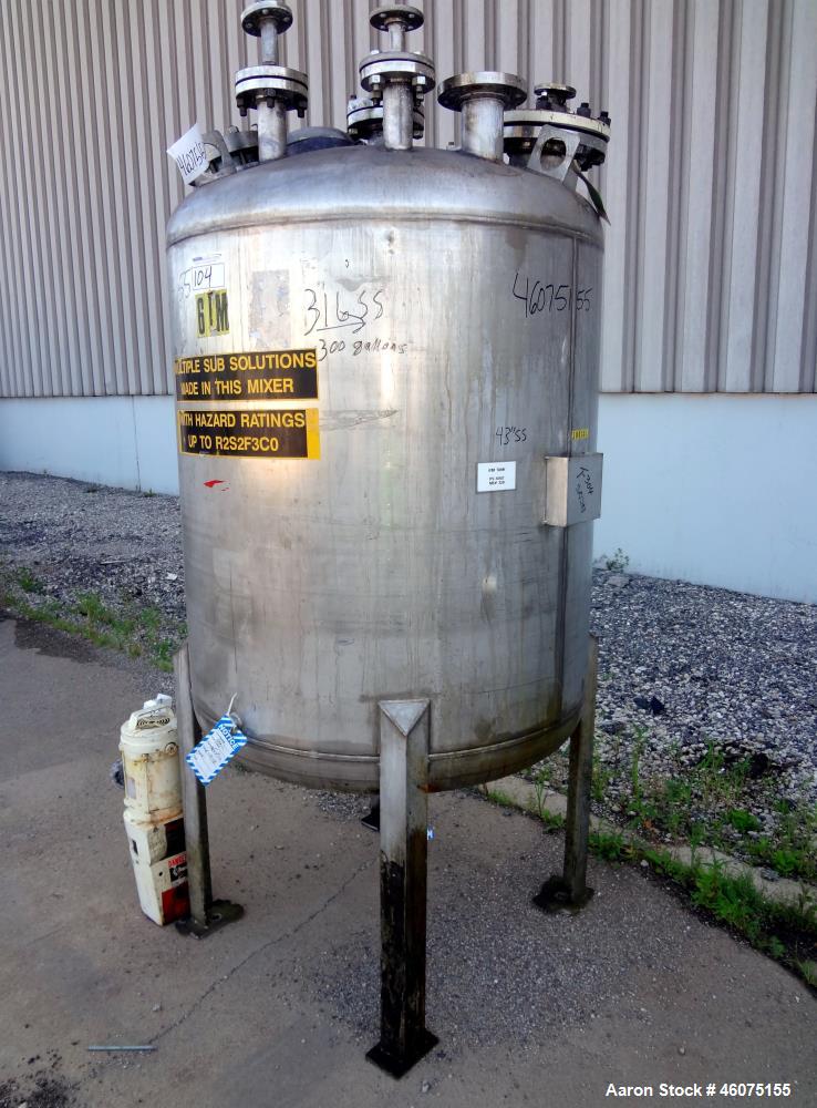 Used Tank, 275 Gallon, 304 Stainless Steel, Vertical. Approximate 42" diameter x 43" straight side, dished top & bottom. Off center top entering Lightnin agitator, model EKXJC-43, serial# 93/B35827-3...