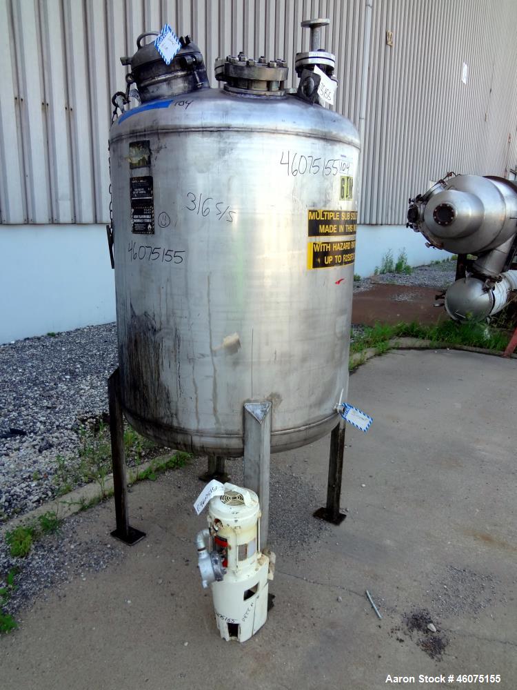 Used Tank, 275 Gallon, 304 Stainless Steel, Vertical. Approximate 42" diameter x 43" straight side, dished top & bottom. Off center top entering Lightnin agitator, model EKXJC-43, serial# 93/B35827-3...