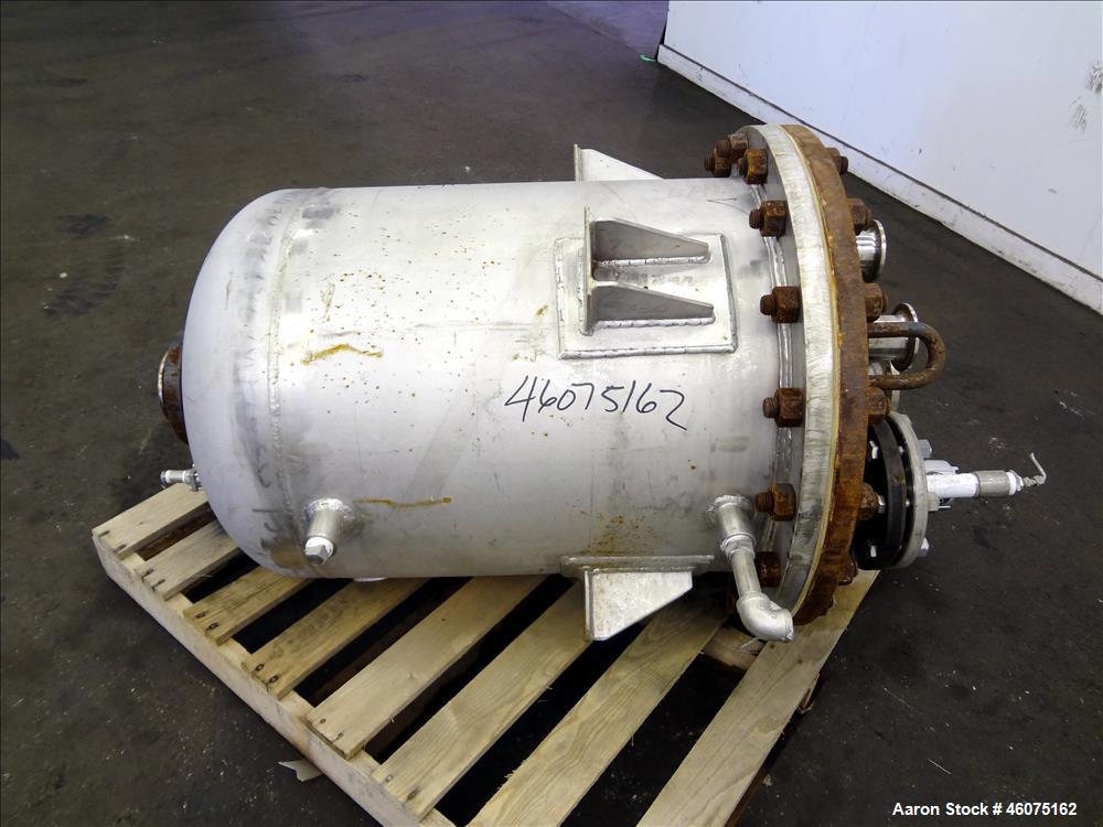 Used Tank, 50 Gallon, 304 Stainless Steel, Vertical. Approximate 24" diameter x 24" straight side, flat bolt top, dished bottom. Top openings: (2) 2", (2) 4", (1) 1-1/2", (1) 1". 3" Center bottom out...