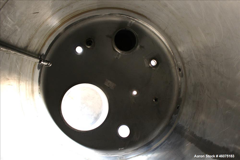 Used Tank, 500 Gallon, 304 Stainless Steel, Vertical. Approximate 48" diameter x 60" straight side, dished top & bottom. Openings top: 16" man way with hinged cover, (1) 4" sight glass, (1) 8", (3) 2...
