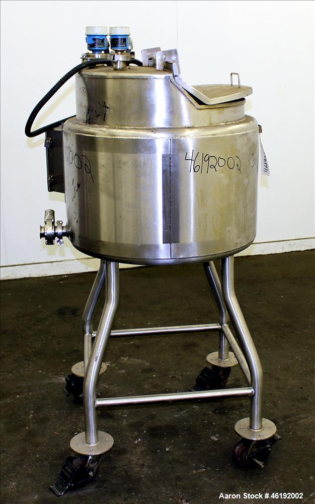 Used Tank, Approximately 30 Gallon, 304 Stainless steel. 23-1/2" Diameter x 16" straight side, insulated. Flat top, sloped bottom. Openings: (4) 2" tri-clamp, hinged top cover; 1-1/2" side bottom out...