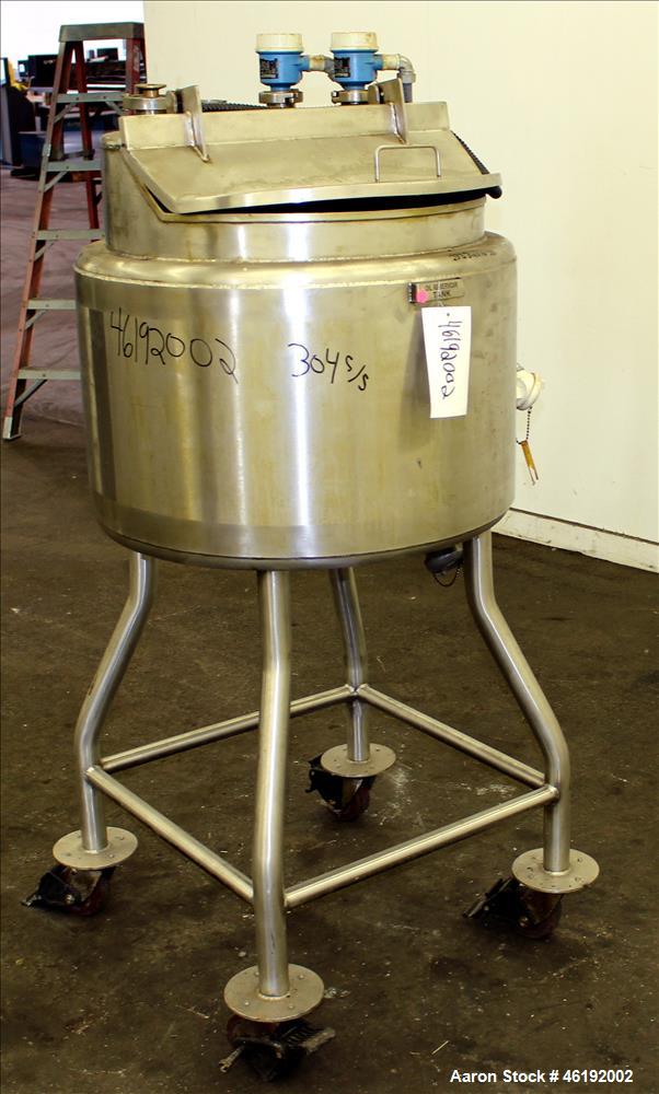 Used Tank, Approximately 30 Gallon, 304 Stainless steel. 23-1/2" Diameter x 16" straight side, insulated. Flat top, sloped bottom. Openings: (4) 2" tri-clamp, hinged top cover; 1-1/2" side bottom out...