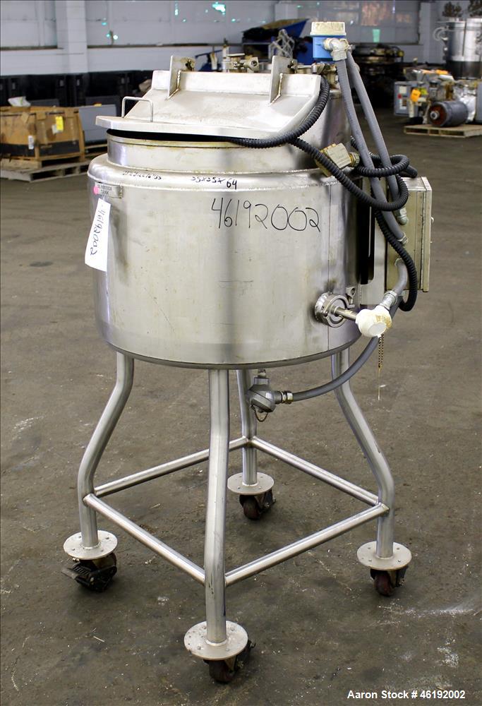 Used Tank, Approximately 30 Gallon, 304 Stainless steel. 23-1/2" Diameter x 16" straight side, insulated. Flat top, sloped bottom. Openings: (4) 2" tri-clamp, hinged top cover; 1-1/2" side bottom out...