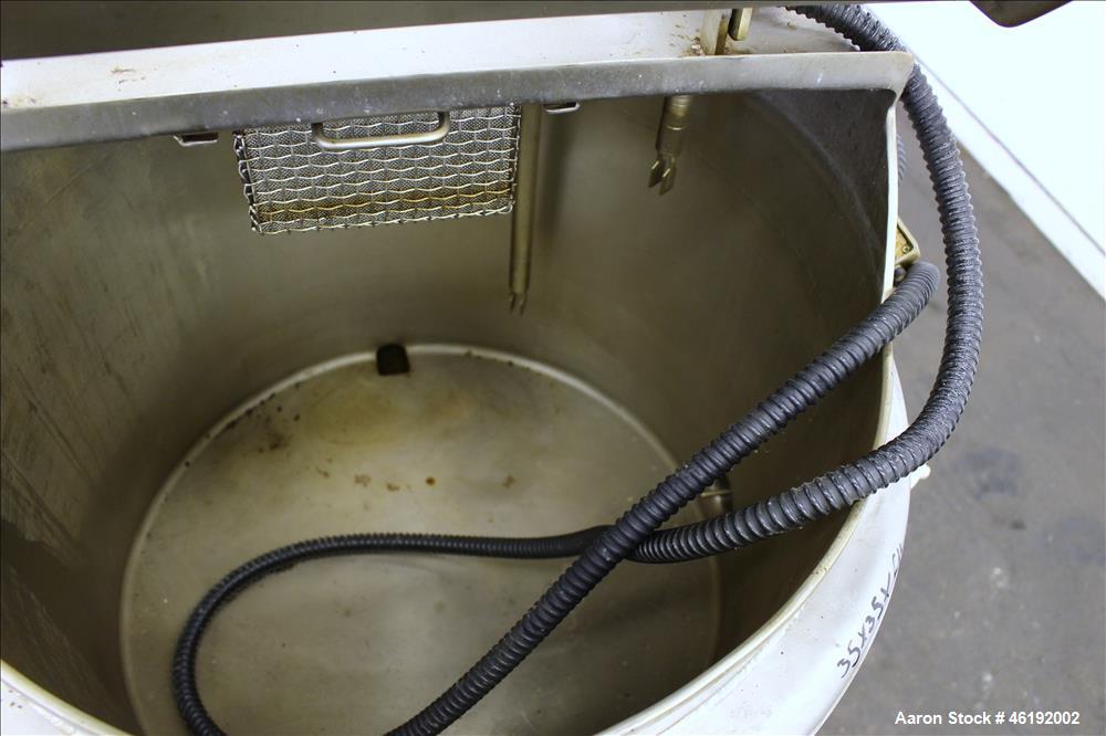 Used Tank, Approximately 30 Gallon, 304 Stainless steel. 23-1/2" Diameter x 16" straight side, insulated. Flat top, sloped bottom. Openings: (4) 2" tri-clamp, hinged top cover; 1-1/2" side bottom out...