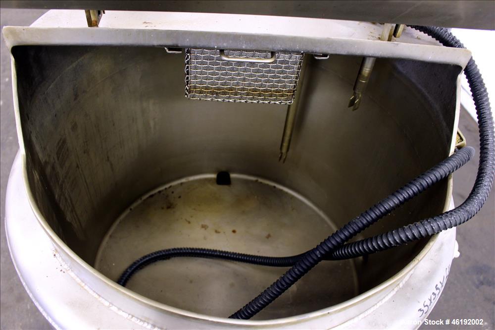 Used Tank, Approximately 30 Gallon, 304 Stainless steel. 23-1/2" Diameter x 16" straight side, insulated. Flat top, sloped bottom. Openings: (4) 2" tri-clamp, hinged top cover; 1-1/2" side bottom out...