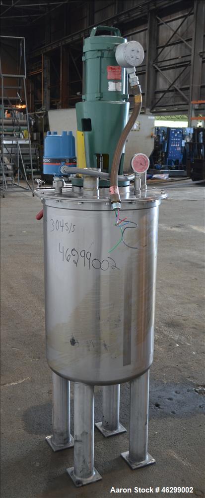 Used Tank, Approximately 40 Gallons, 304 Stainless Steel, Vertical. 20" Diameter x 30" straight side. Bolt-on flat top with 1/4 hinged cover, dished bottom. Top entering Lightnin agitator model XJC-3...