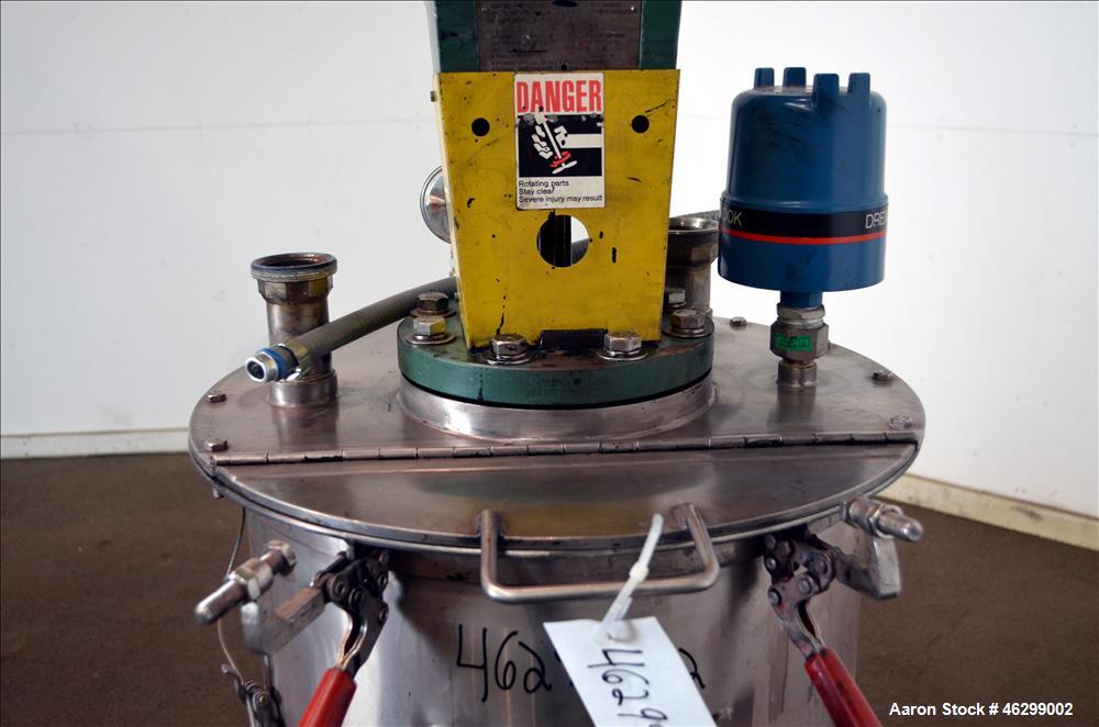 Used Tank, Approximately 40 Gallons, 304 Stainless Steel, Vertical. 20" Diameter x 30" straight side. Bolt-on flat top with 1/4 hinged cover, dished bottom. Top entering Lightnin agitator model XJC-3...