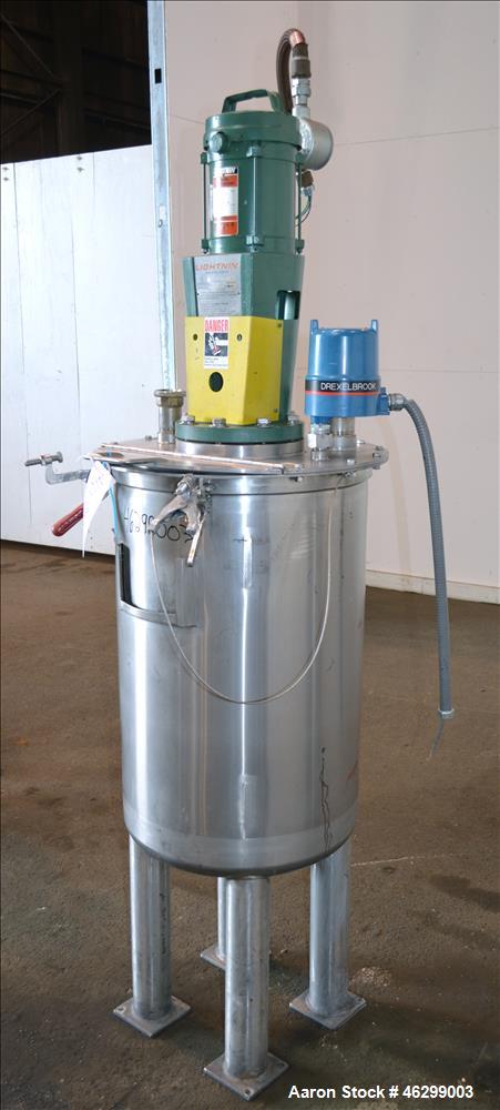 Used Tank, Approximately 40 Gallons, 304 Stainless Steel, Vertical. 20" Diameter x 30" straight side. Bolt-on flat top with 1/4 hinged cover, dished bottom. Top entering Lightnin agitator model XJC-3...