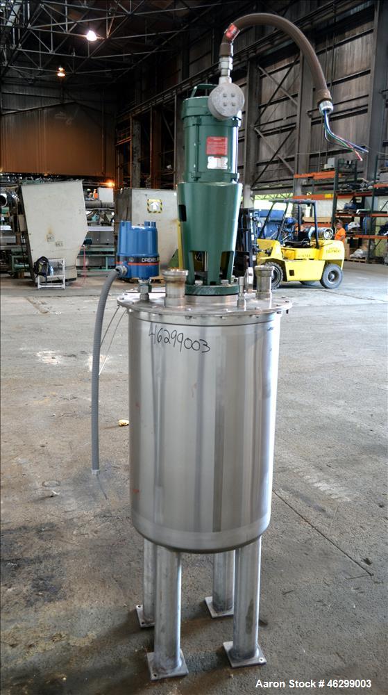 Used Tank, Approximately 40 Gallons, 304 Stainless Steel, Vertical. 20" Diameter x 30" straight side. Bolt-on flat top with 1/4 hinged cover, dished bottom. Top entering Lightnin agitator model XJC-3...