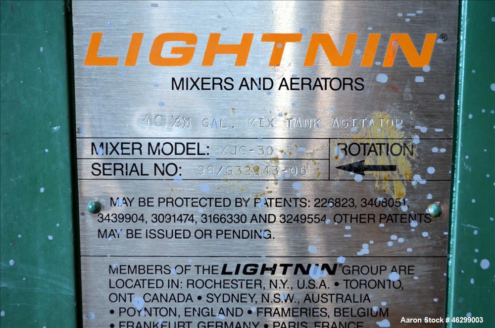Used Tank, Approximately 40 Gallons, 304 Stainless Steel, Vertical. 20" Diameter x 30" straight side. Bolt-on flat top with 1/4 hinged cover, dished bottom. Top entering Lightnin agitator model XJC-3...