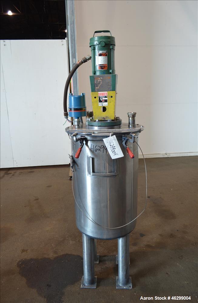 Used Tank, Approximately 40 Gallons, 304 Stainless Steel, Vertical. 20" Diameter x 30" straight side. Bolt-on flat top with 1/4 hinged cover, dished bottom. Top entering Lightnin agitator model XJC-3...
