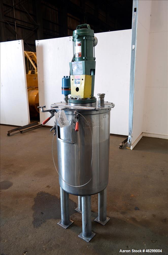 Used Tank, Approximately 40 Gallons, 304 Stainless Steel, Vertical. 20" Diameter x 30" straight side. Bolt-on flat top with 1/4 hinged cover, dished bottom. Top entering Lightnin agitator model XJC-3...