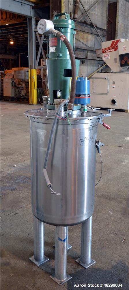 Used Tank, Approximately 40 Gallons, 304 Stainless Steel, Vertical. 20" Diameter x 30" straight side. Bolt-on flat top with 1/4 hinged cover, dished bottom. Top entering Lightnin agitator model XJC-3...