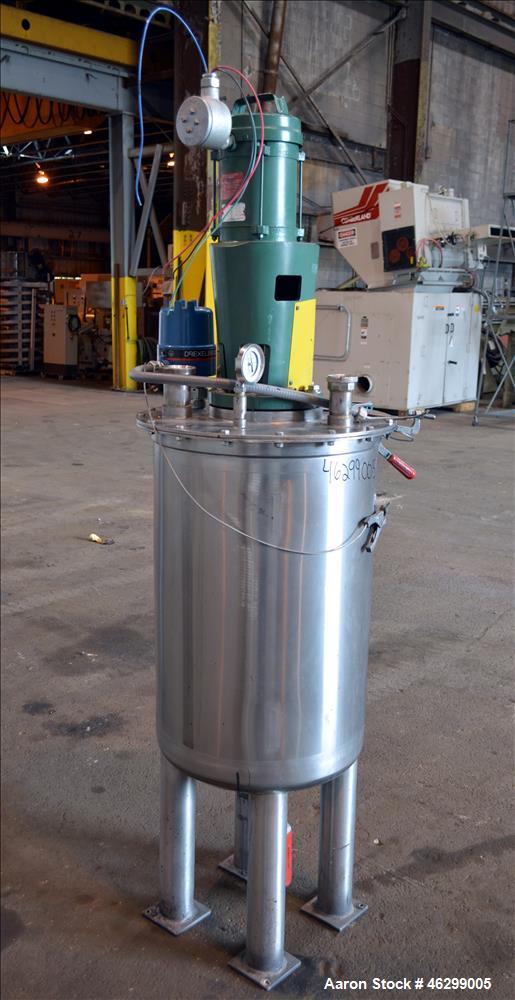 Used Tank, Approximately 40 Gallons, 304 Stainless Steel, Vertical. 20" Diameter x 30" straight side. Bolt-on flat top with 1/4 hinged cover, dished bottom. Top entering Lightnin agitator model XJC-3...