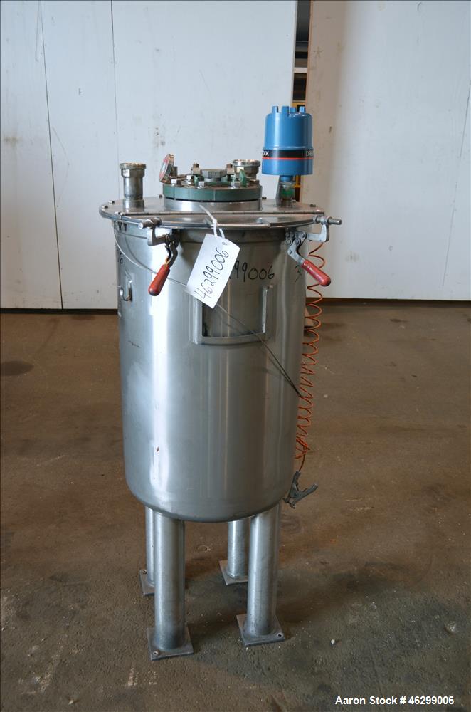 Used Tank, Approximately 40 Gallons, 304 Stainless Steel, Vertical. 20" Diameter x 30" straight side. Bolt-on flat top with 1/4 hinged cover, dished bottom. Top entering agitator (no motor), with 1" ...