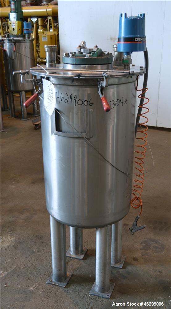 Used Tank, Approximately 40 Gallons, 304 Stainless Steel, Vertical. 20" Diameter x 30" straight side. Bolt-on flat top with 1/4 hinged cover, dished bottom. Top entering agitator (no motor), with 1" ...