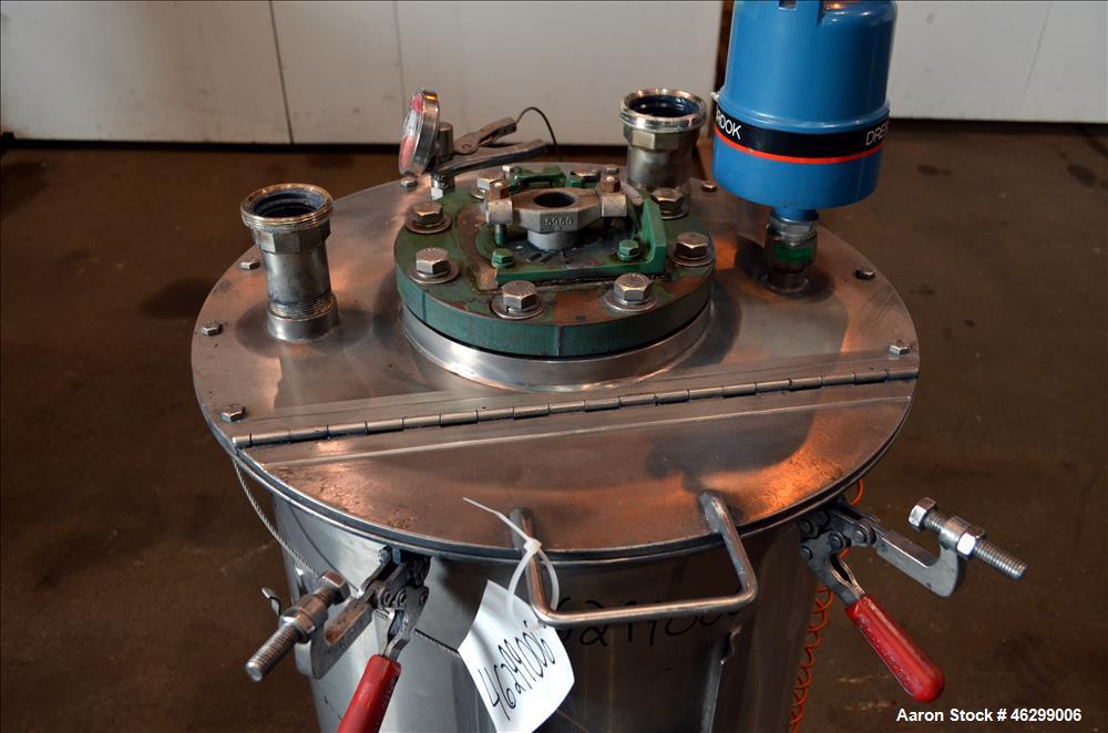 Used Tank, Approximately 40 Gallons, 304 Stainless Steel, Vertical. 20" Diameter x 30" straight side. Bolt-on flat top with 1/4 hinged cover, dished bottom. Top entering agitator (no motor), with 1" ...