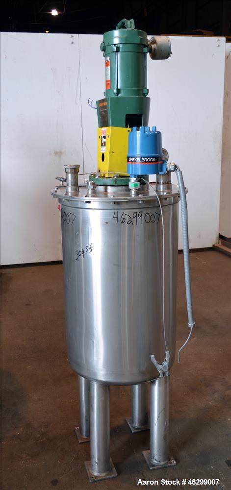 Used Tank, Approximately 40 Gallons, 304 Stainless Steel, Vertical. 20" Diameter x 30" straight side. Bolt-on flat top with 1/4 hinged cover, dished bottom. Top entering Lightnin agitator model XJC-3...