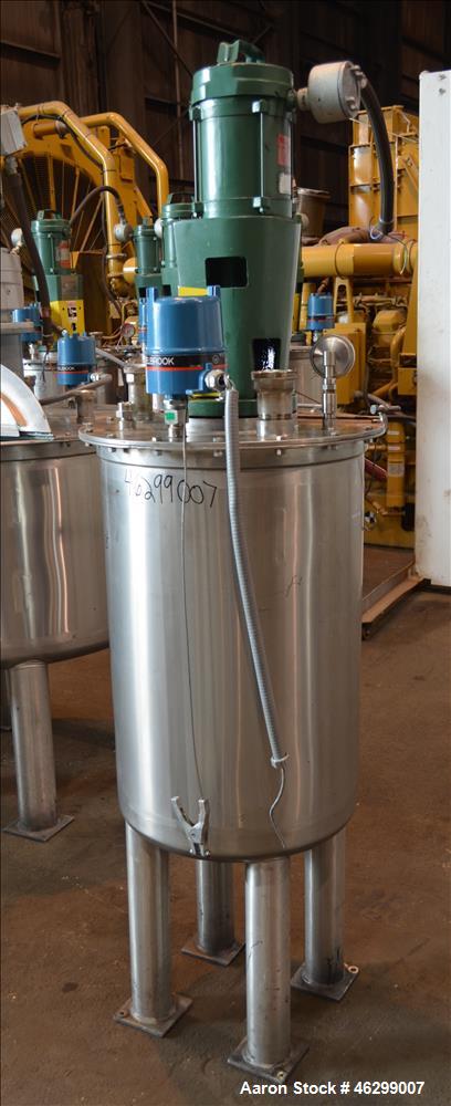 Used Tank, Approximately 40 Gallons, 304 Stainless Steel, Vertical. 20" Diameter x 30" straight side. Bolt-on flat top with 1/4 hinged cover, dished bottom. Top entering Lightnin agitator model XJC-3...
