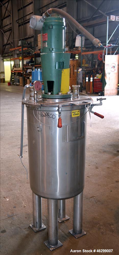 Used Tank, Approximately 40 Gallons, 304 Stainless Steel, Vertical. 20" Diameter x 30" straight side. Bolt-on flat top with 1/4 hinged cover, dished bottom. Top entering Lightnin agitator model XJC-3...