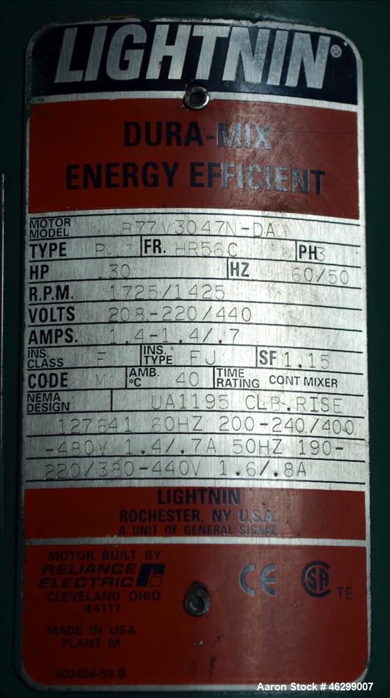 Used Tank, Approximately 40 Gallons, 304 Stainless Steel, Vertical. 20" Diameter x 30" straight side. Bolt-on flat top with 1/4 hinged cover, dished bottom. Top entering Lightnin agitator model XJC-3...