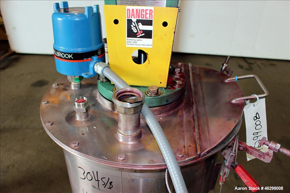 Used Tank, Approximately 40 Gallons, 304 Stainless Steel, Vertical. 20" Diameter x 30" straight side. Bolt-on flat top with 1/4 hinged cover, dished bottom. Top entering Lightnin agitator model XJC-3...