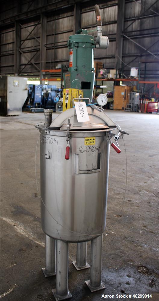 Used Tank, Approximately 40 Gallons, 304 Stainless Steel, Vertical. 20" Diameter x 30" straight side. Bolt-on flat top with 1/4 hinged cover, dished bottom. Top entering Lightnin agitator model XJC-3...