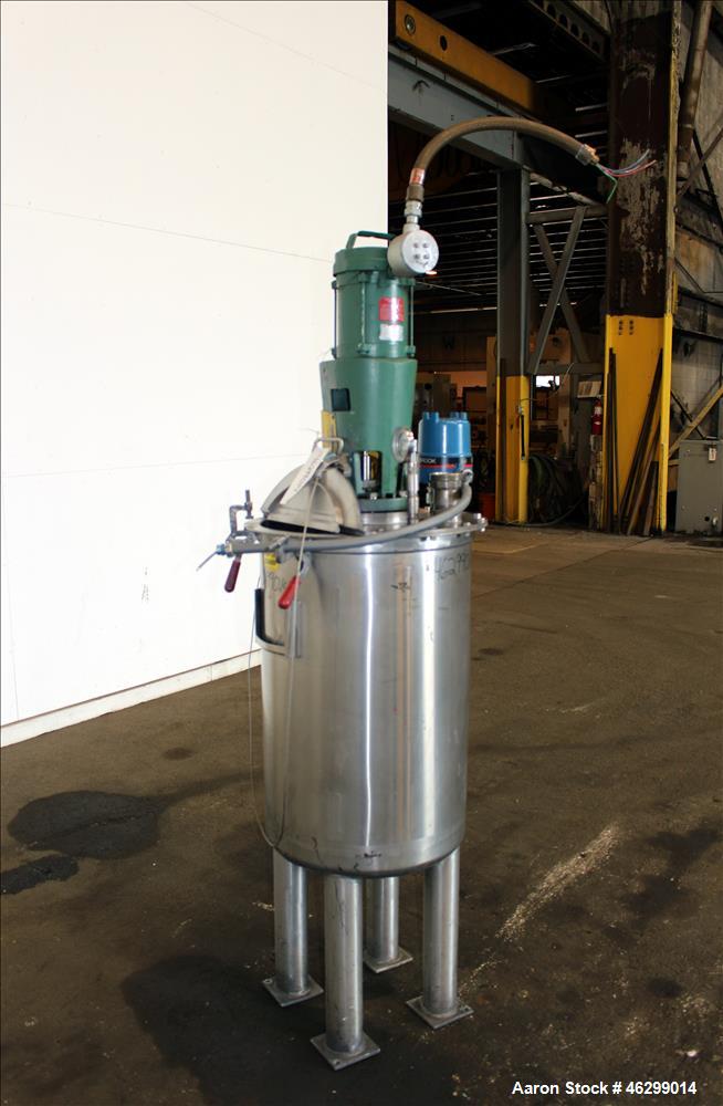 Used Tank, Approximately 40 Gallons, 304 Stainless Steel, Vertical. 20" Diameter x 30" straight side. Bolt-on flat top with 1/4 hinged cover, dished bottom. Top entering Lightnin agitator model XJC-3...