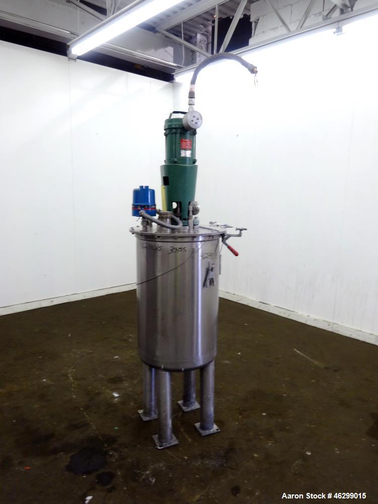 Used Tank, Approximately 40 Gallons, 304 Stainless Steel, Vertical. 20" Diameter x 30" straight side. Bolt-on flat top with 1/4 hinged cover, dished bottom. Top entering Lightnin agitator model XJC-3...