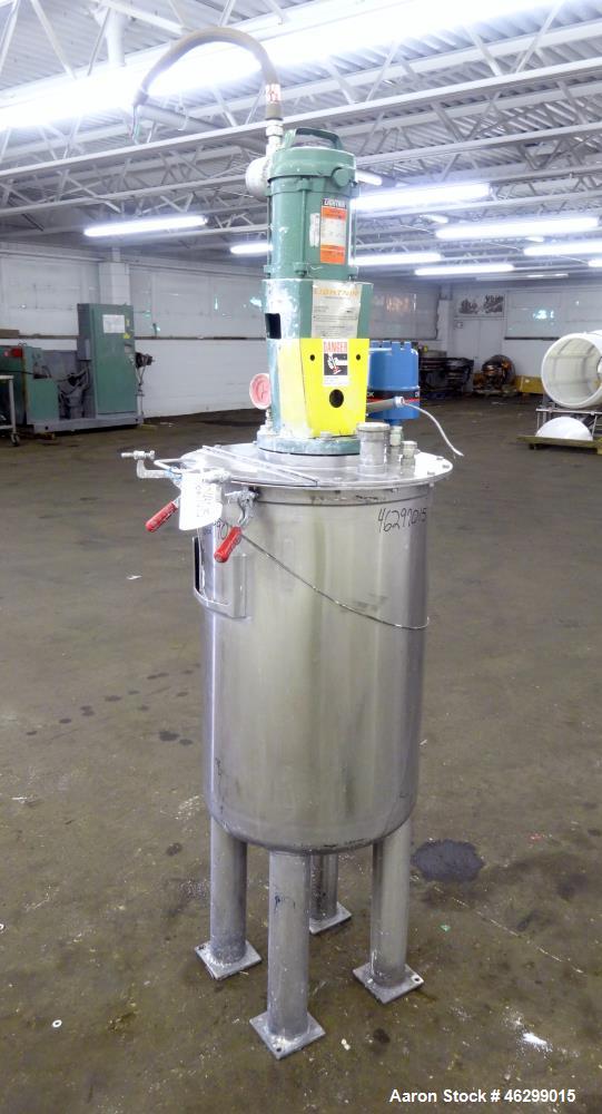 Used Tank, Approximately 40 Gallons, 304 Stainless Steel, Vertical. 20" Diameter x 30" straight side. Bolt-on flat top with 1/4 hinged cover, dished bottom. Top entering Lightnin agitator model XJC-3...