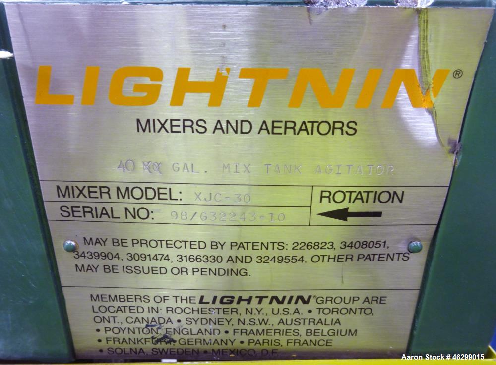 Used Tank, Approximately 40 Gallons, 304 Stainless Steel, Vertical. 20" Diameter x 30" straight side. Bolt-on flat top with 1/4 hinged cover, dished bottom. Top entering Lightnin agitator model XJC-3...